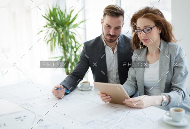 demo-attachment-818-portrait-of-young-architect-woman-on-meeting-KFZCE3A